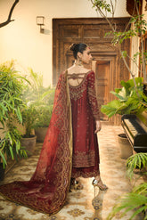Elegant red cotton net 3-piece suit with intricate embroidery and organza dupatta.