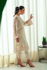 Off-white 2-piece ensemble with contrasting embroidery and tapered shalwar.