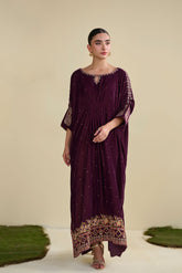 FW25DA-2806 Jewel-toned magenta velvet kaftan with gold craftsmanship on cuffs and neckline.