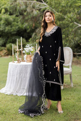 FW25DA-2833 Classic black velvet kurta with intricate silver embroidery on the borders and neckline, paired with solid black pants.