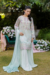 Mint green silk tunic featuring lilac and blush thread embroidery with subtle sequin accents.