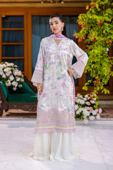 Off-white silk tunic blooming in lilac and blush tones with plain flared trousers and scalloped borders.