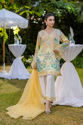 Soft yellow silk ensemble featuring floral and paisley motifs in blue, green, and peach tones.