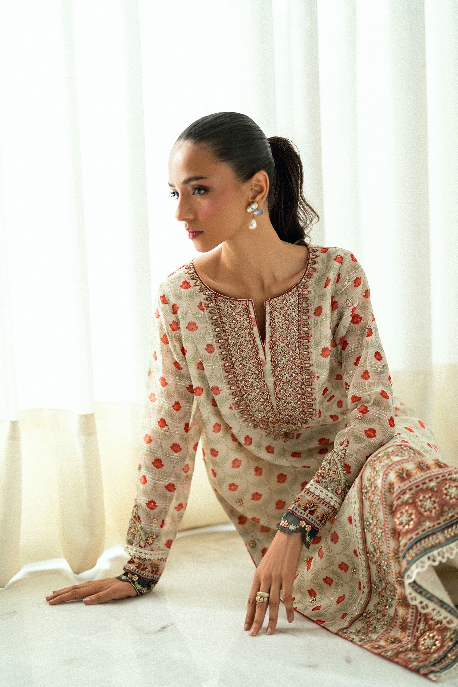 Cream 2-piece silk suit featuring delicate floral embroidery on the kurta.