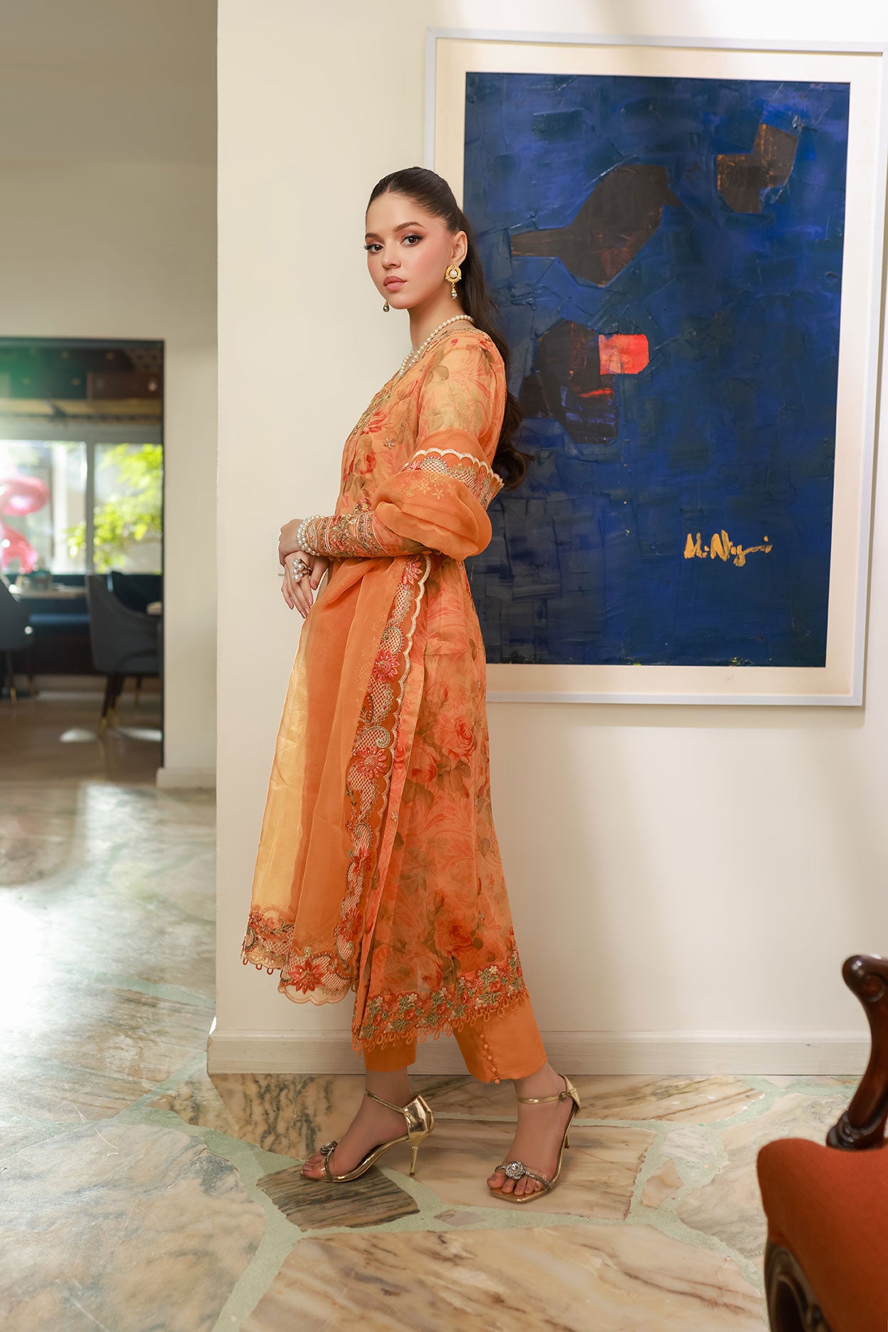 SS25DA-2716 Orange 2-piece printed chiffon kurta with floral embroidery and lace detailing on daman and sleeves.