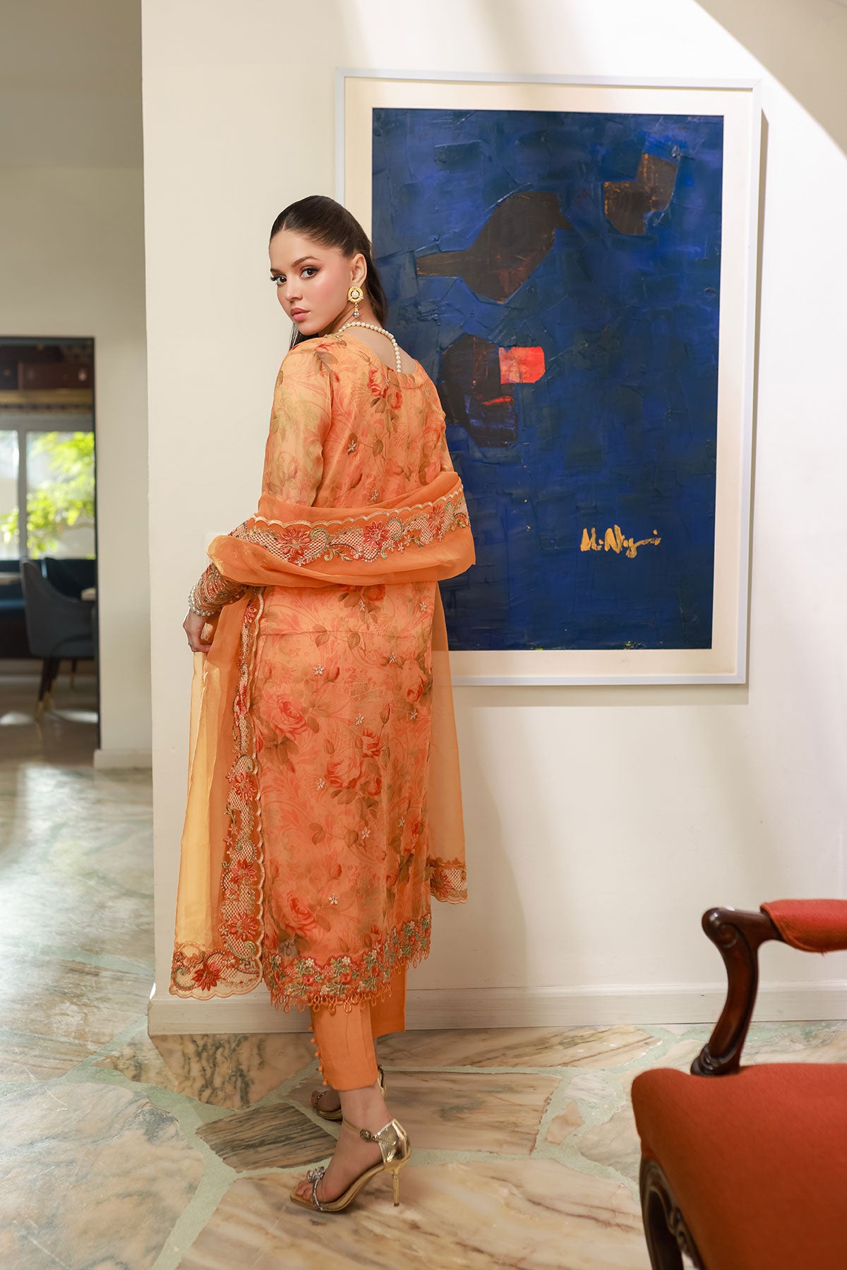 SS25DA-2716 Orange 2-piece printed chiffon kurta with floral embroidery and lace detailing on daman and sleeves.