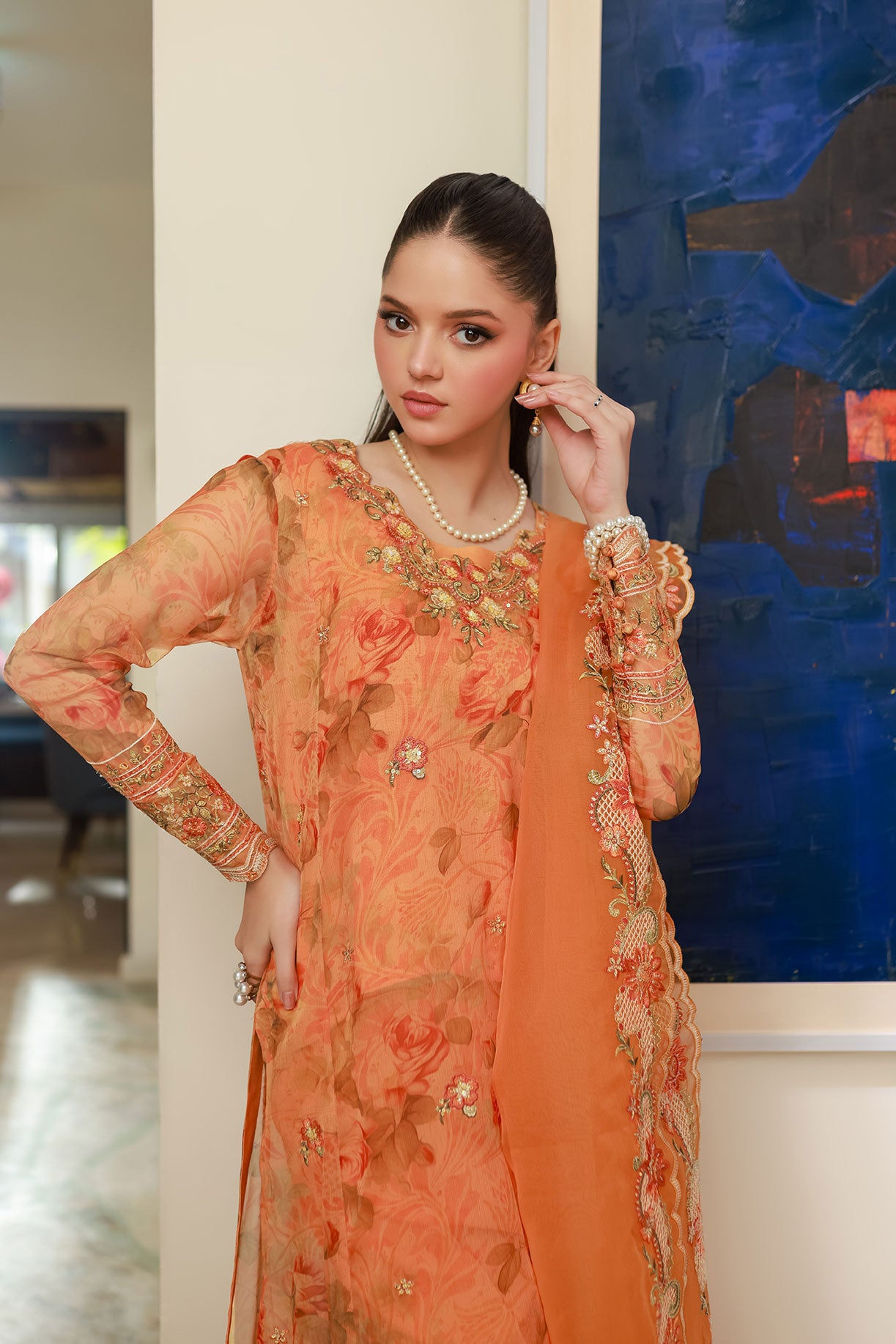 SS25DA-2716 Orange 2-piece printed chiffon kurta with floral embroidery and lace detailing on daman and sleeves.