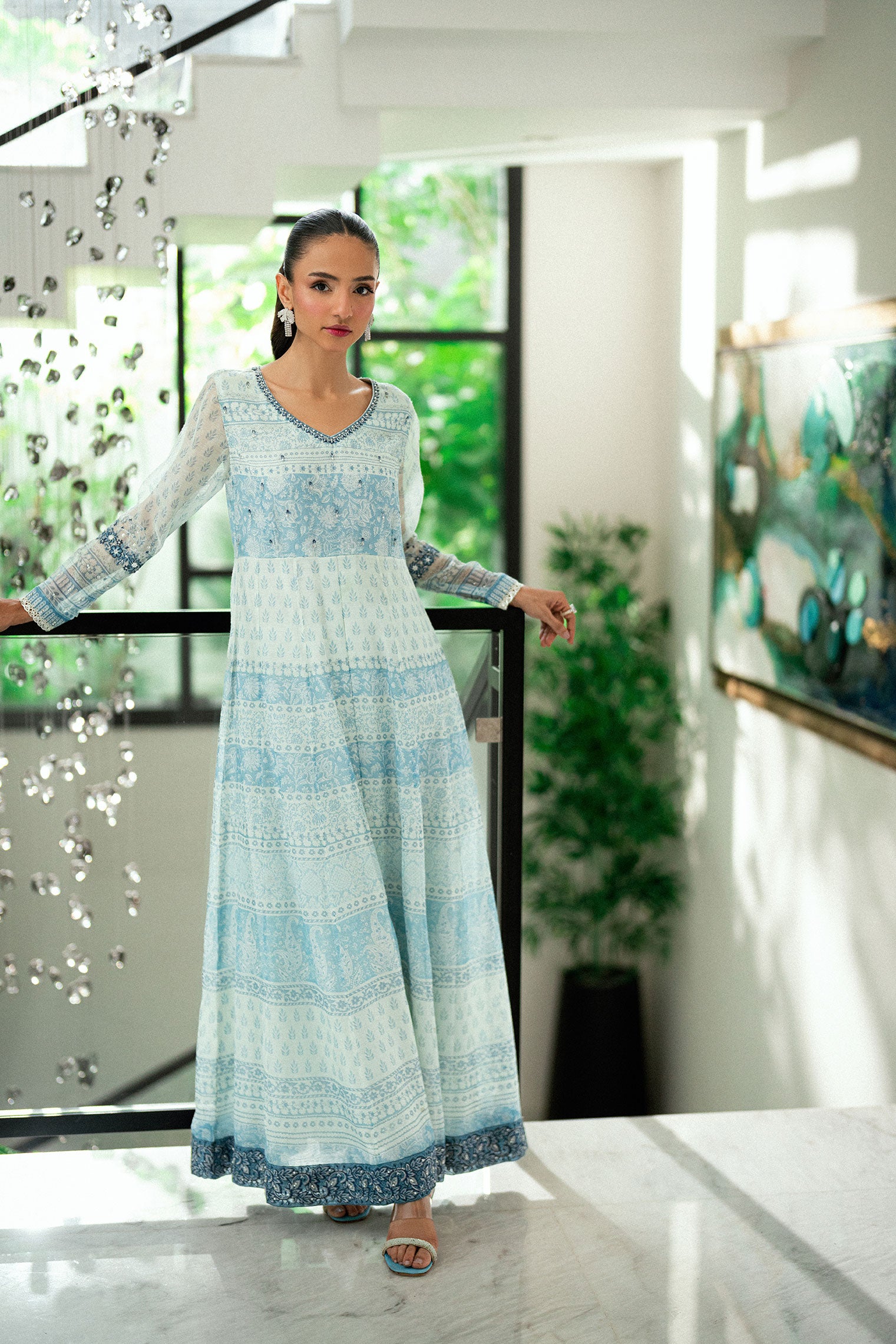 Sky blue 2-piece silk suit with delicate floral embroidery and straight pants.