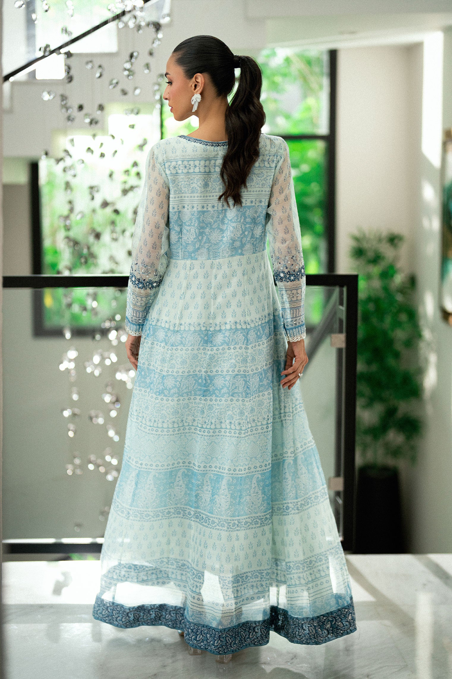 Sky blue 2-piece silk suit with delicate floral embroidery and straight pants.