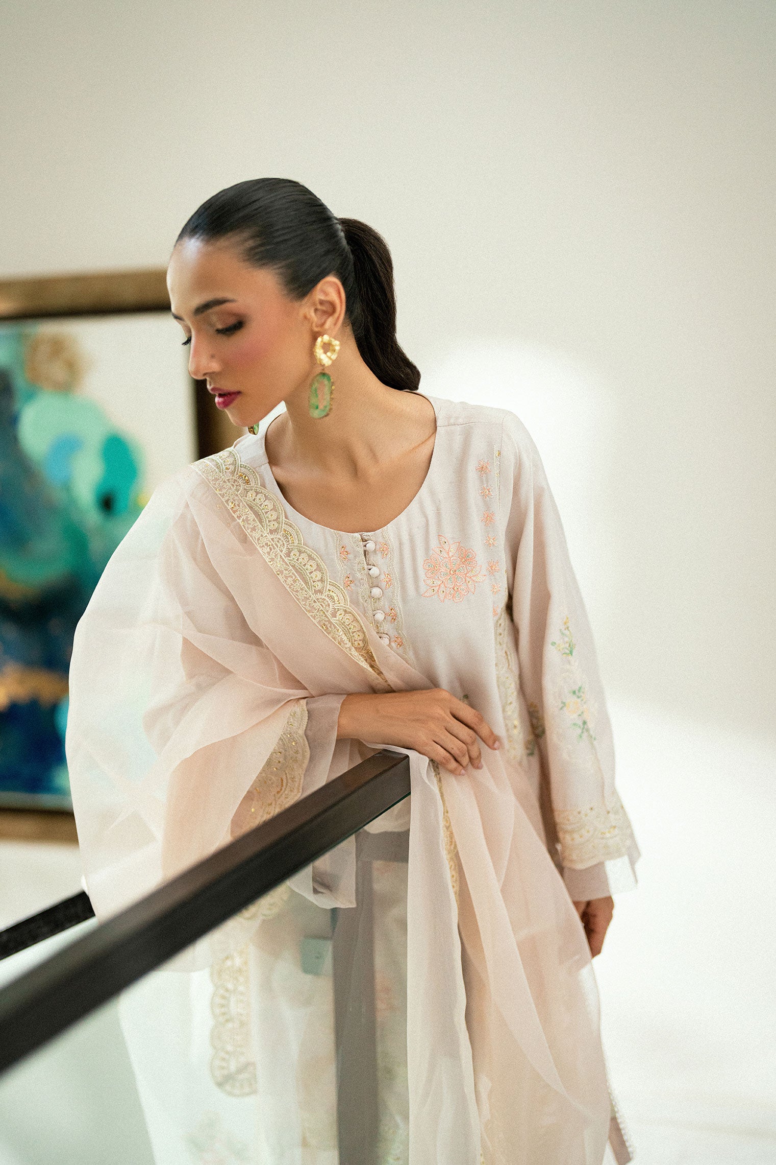 Tea pink 2-piece embroidered kurta with matching trousers and lace accents.