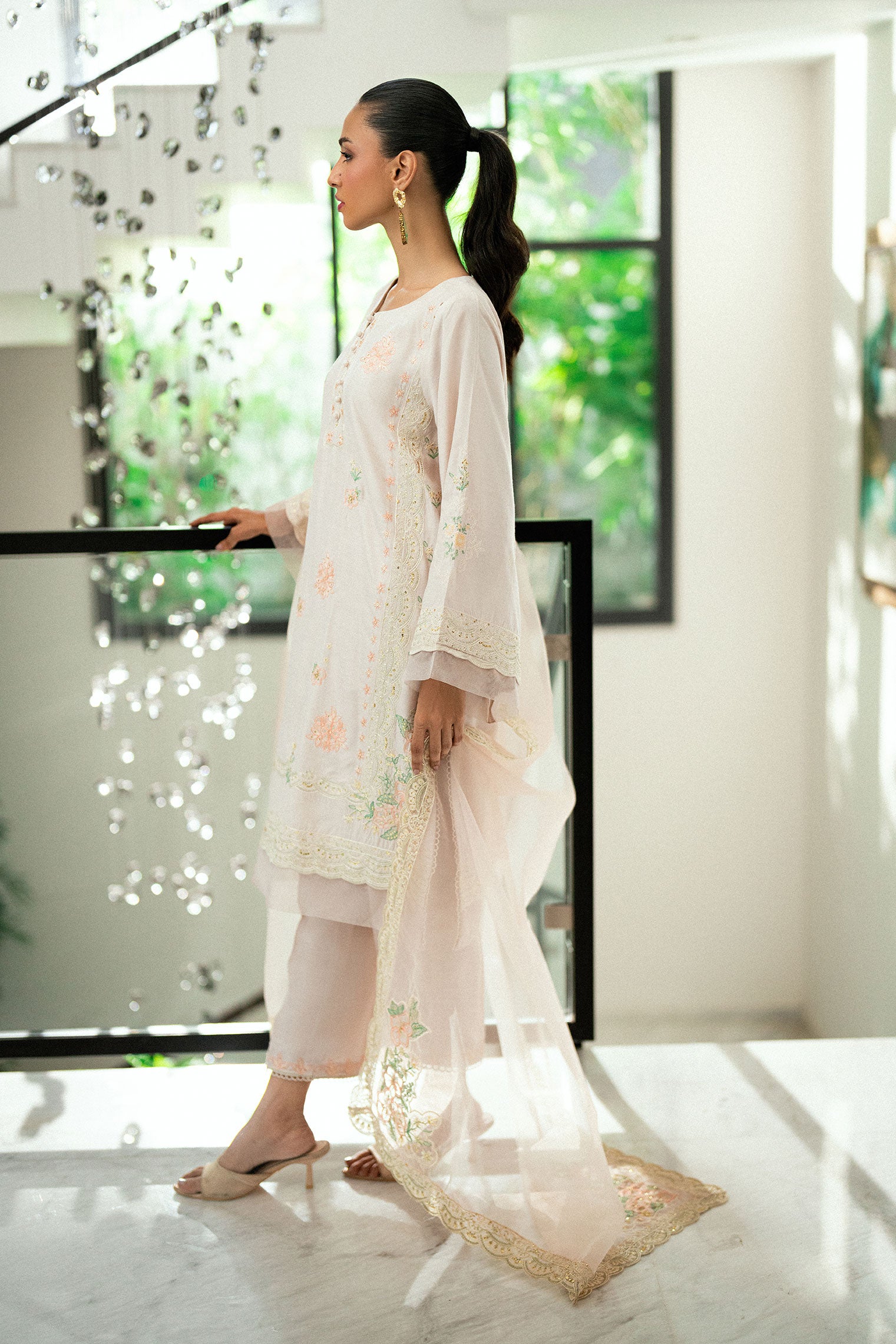 Tea pink 2-piece embroidered kurta with matching trousers and lace accents.
