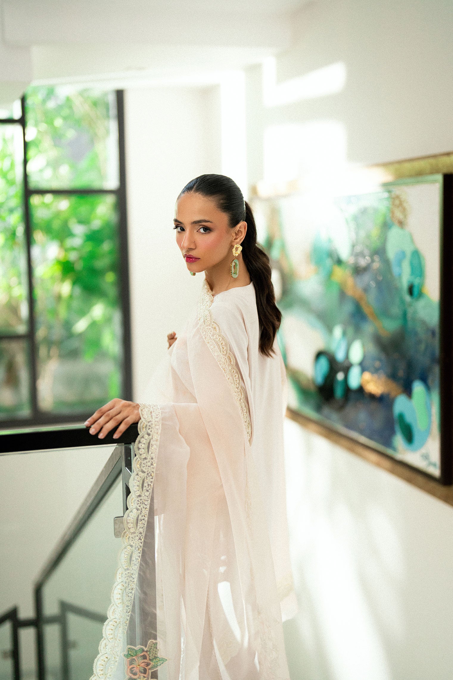 Tea pink 2-piece embroidered kurta with matching trousers and lace accents.