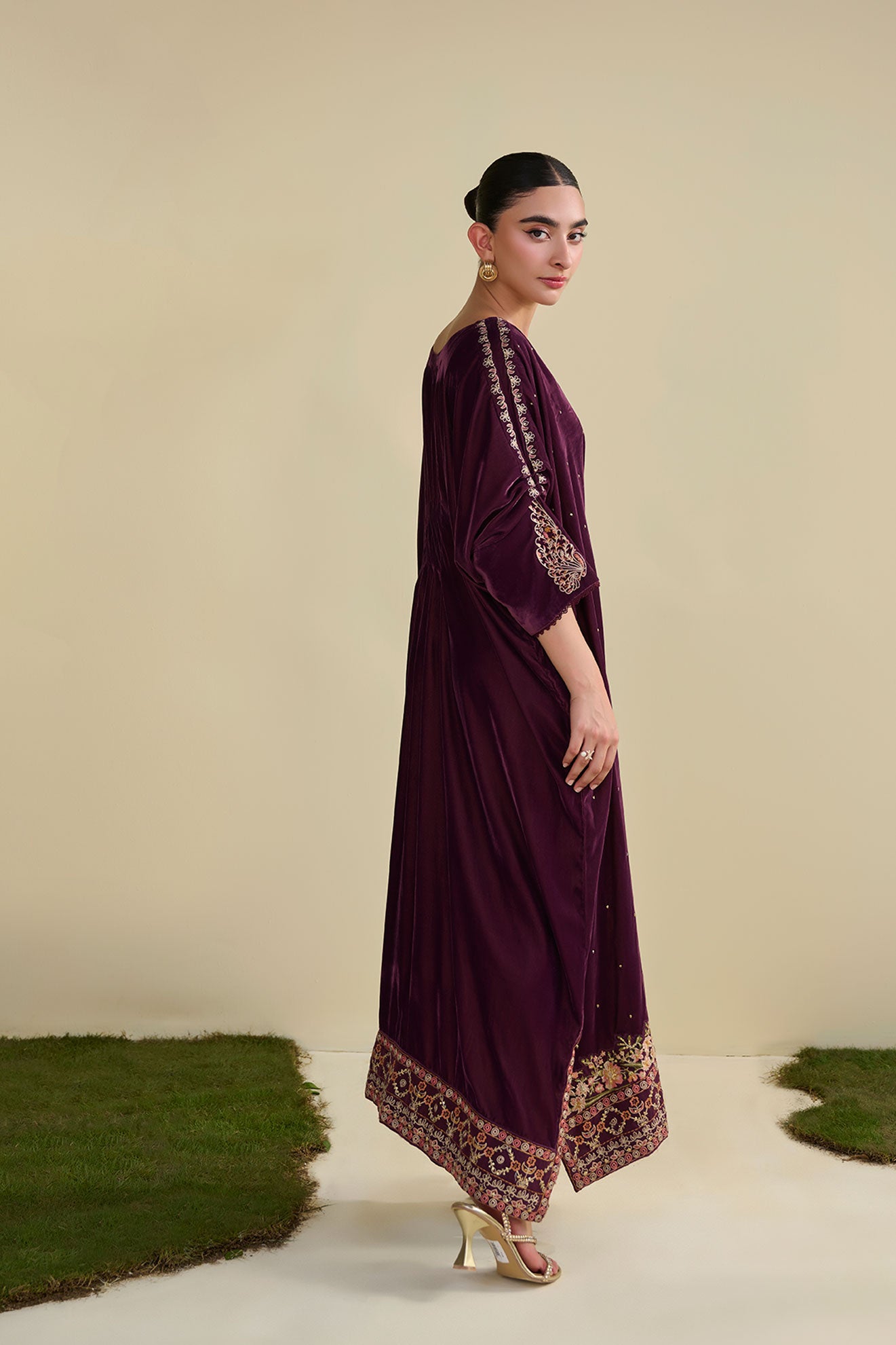 FW25DA-2806 Jewel-toned magenta velvet kaftan with gold craftsmanship on cuffs and neckline.