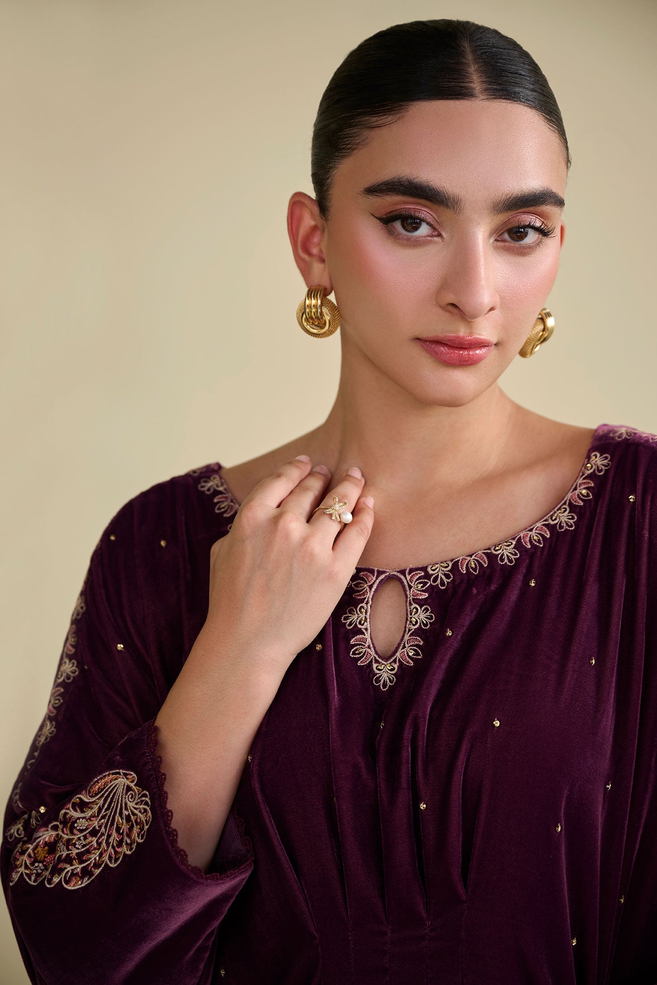 FW25DA-2806 Jewel-toned magenta velvet kaftan with gold craftsmanship on cuffs and neckline.