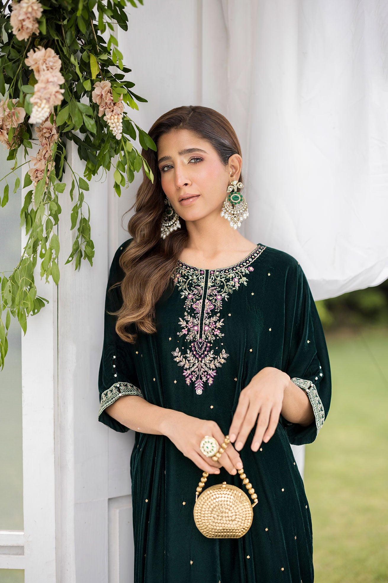 FW25DA-2829 Bottle Green Kaftan: Emerald velvet kaftan with gold and pink embroidery along the neckline and hem for a regal silhouette.