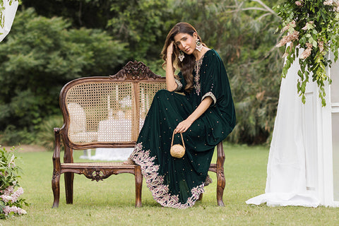 FW25DA-2829 Bottle Green Kaftan: Emerald velvet kaftan with gold and pink embroidery along the neckline and hem for a regal silhouette.