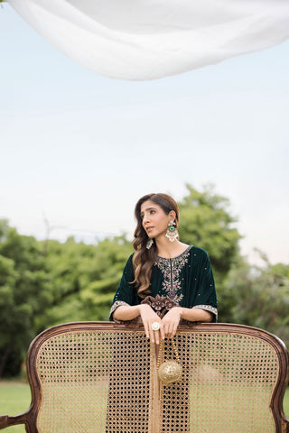 FW25DA-2829 Bottle Green Kaftan: Emerald velvet kaftan with gold and pink embroidery along the neckline and hem for a regal silhouette.