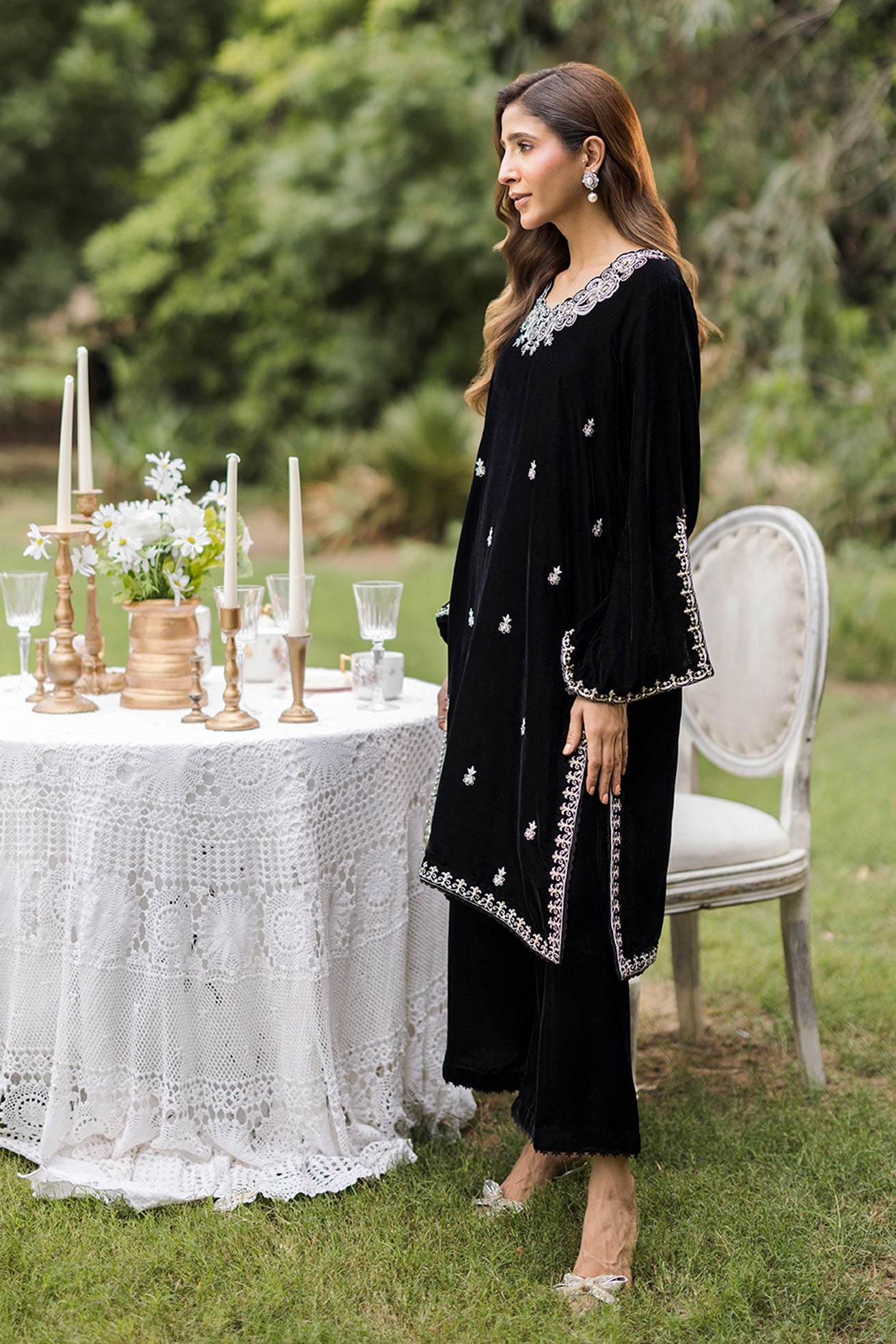 FW25DA-2833 Classic black velvet kurta with intricate silver embroidery on the borders and neckline, paired with solid black pants.