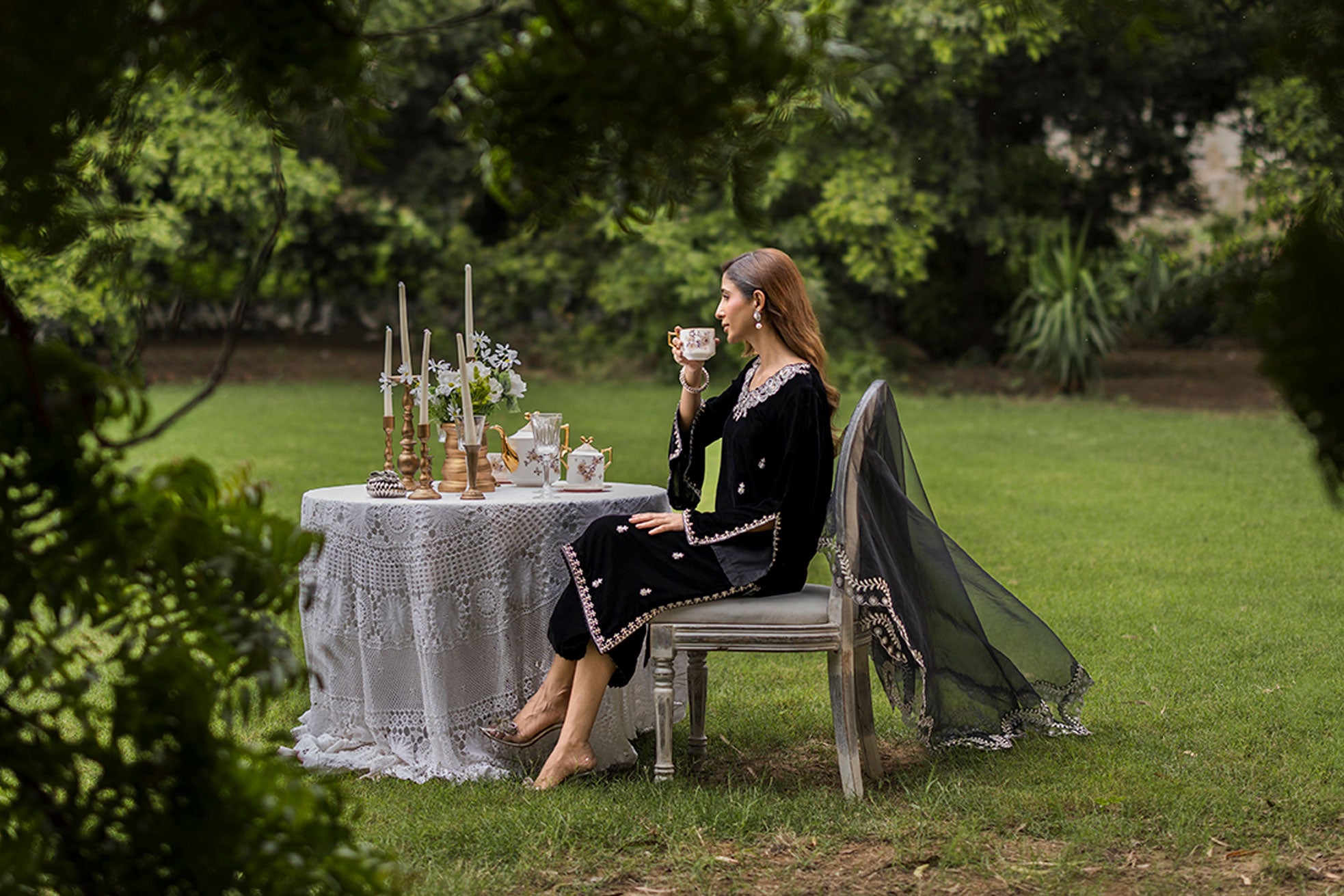 FW25DA-2833 Classic black velvet kurta with intricate silver embroidery on the borders and neckline, paired with solid black pants.