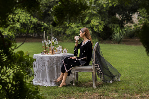 FW25DA-2833 Classic black velvet kurta with intricate silver embroidery on the borders and neckline, paired with solid black pants.