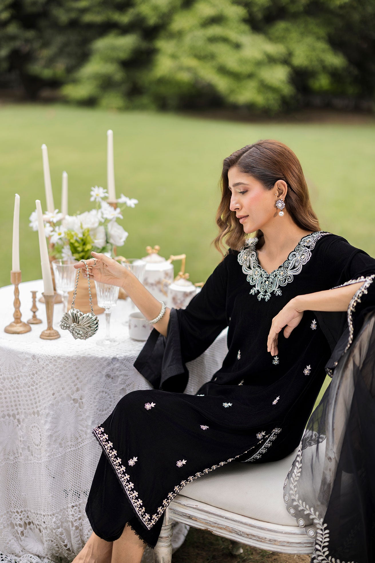 FW25DA-2833 Classic black velvet kurta with intricate silver embroidery on the borders and neckline, paired with solid black pants.