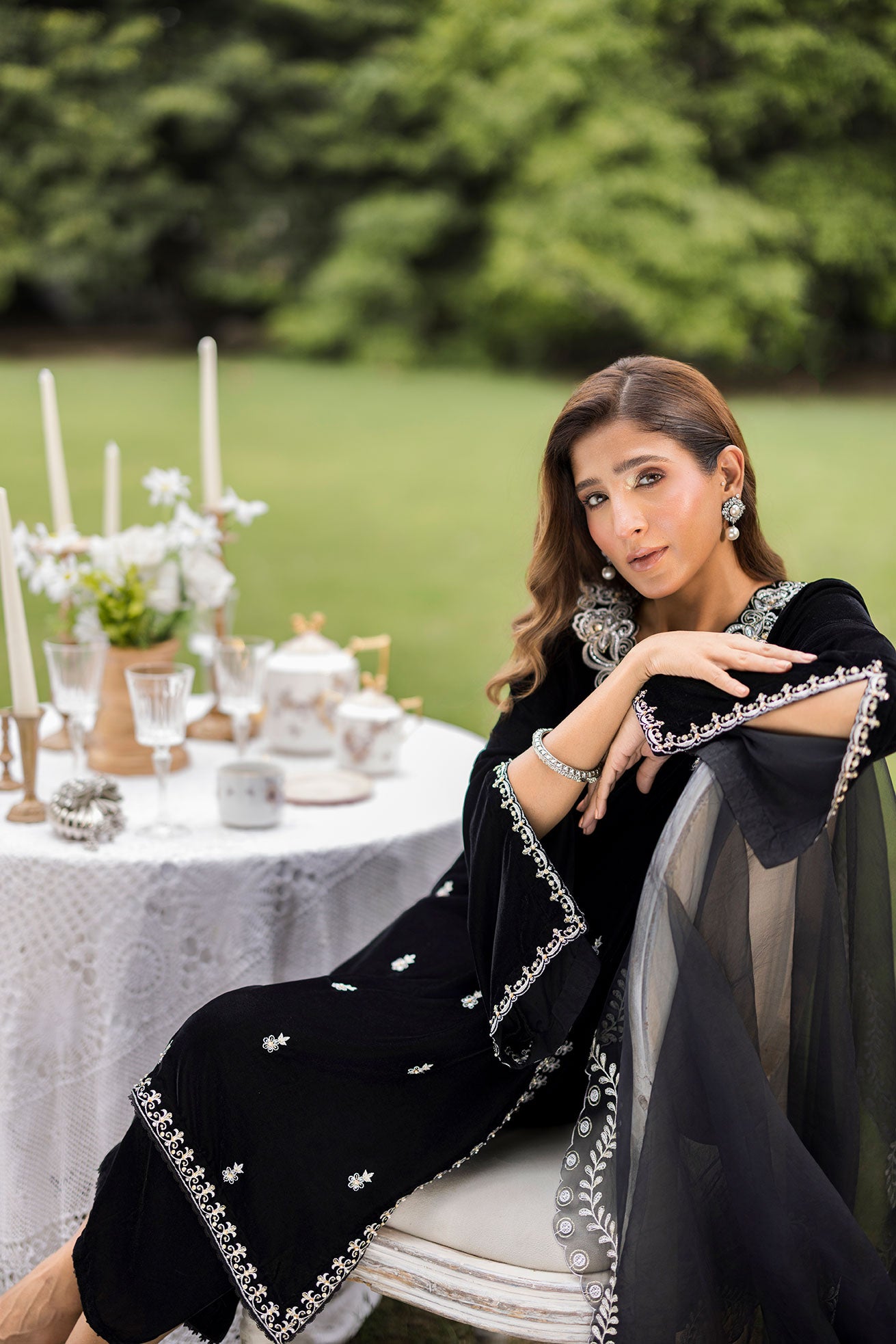 FW25DA-2833 Classic black velvet kurta with intricate silver embroidery on the borders and neckline, paired with solid black pants.