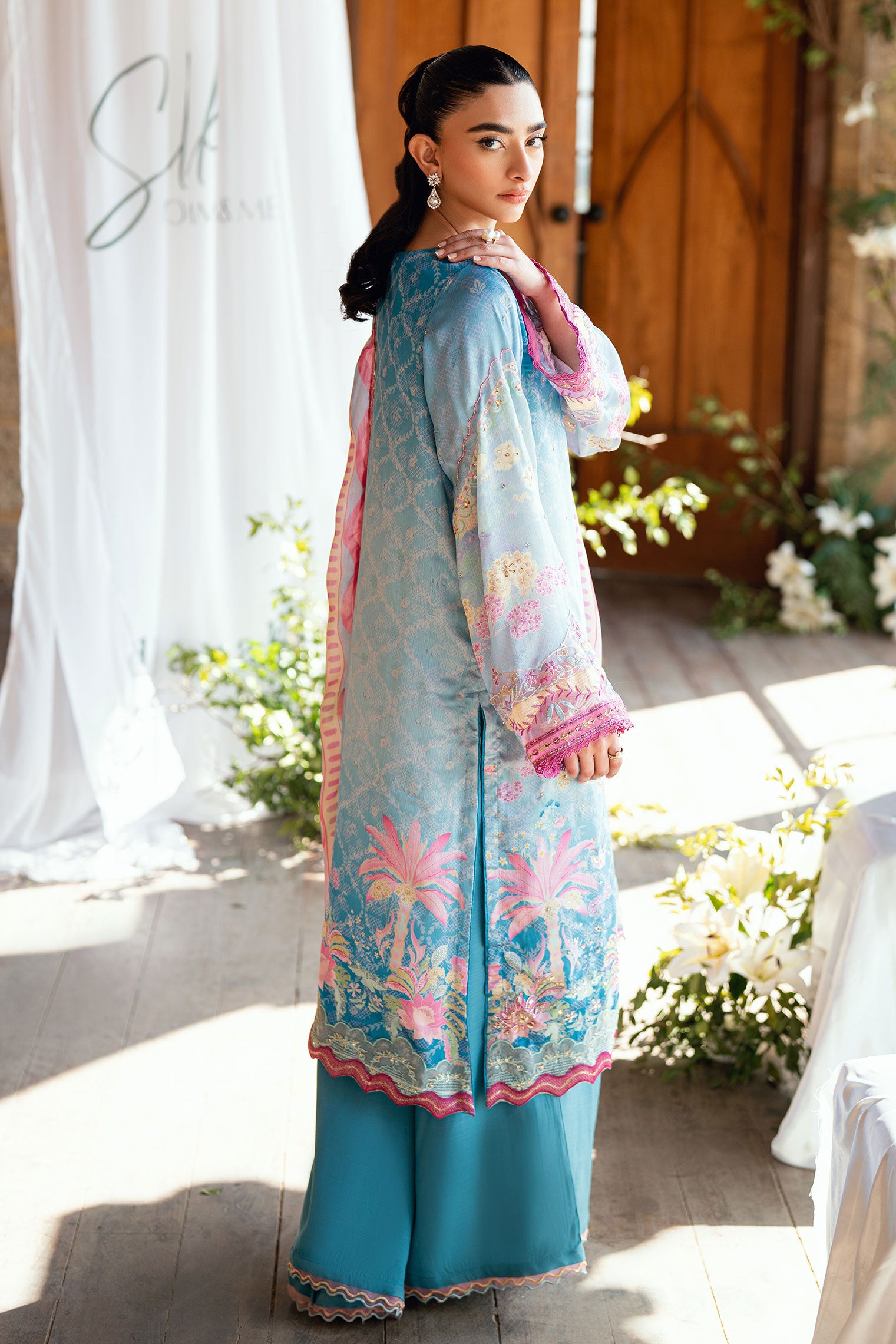 SS26DA-2898 Blue 2-piece satin silk ensemble featuring delicate embroidery over a soft print and flared pants with lace hem.