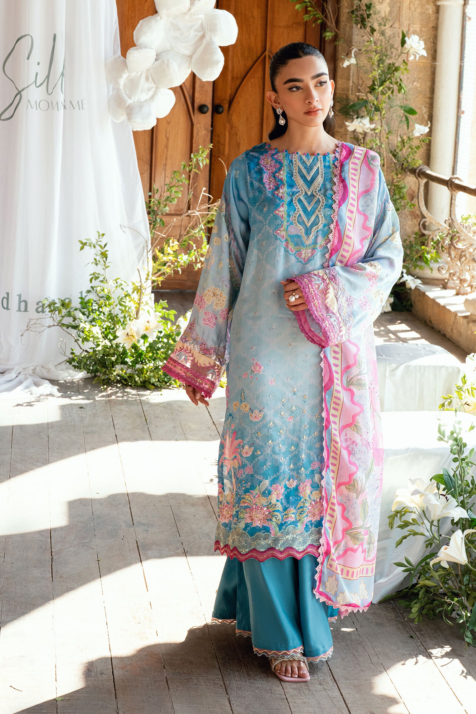 SS26DA-2898 Blue 2-piece satin silk ensemble featuring delicate embroidery over a soft print and flared pants with lace hem.