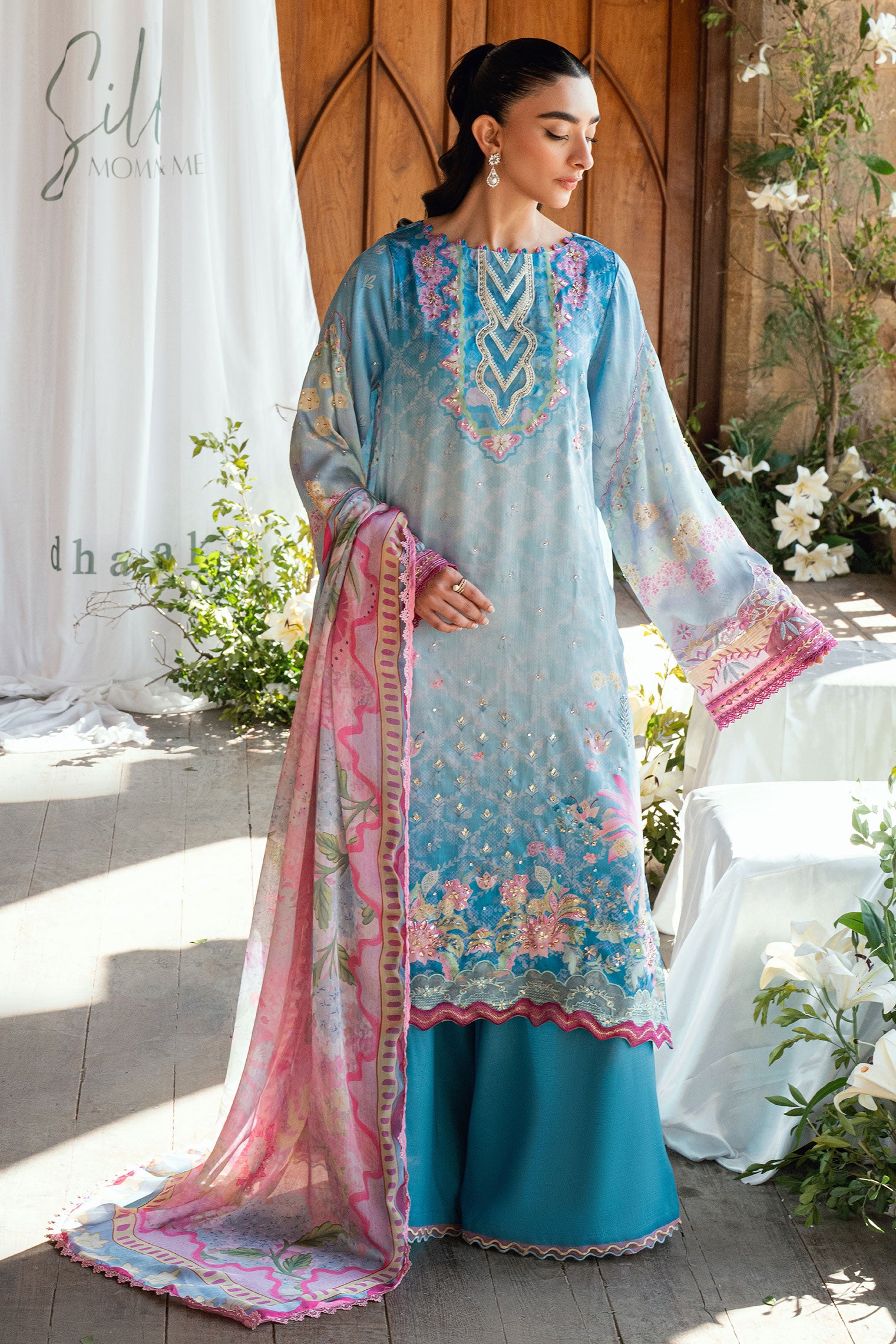 SS26DA-2898 Blue 2-piece satin silk ensemble featuring delicate embroidery over a soft print and flared pants with lace hem.
