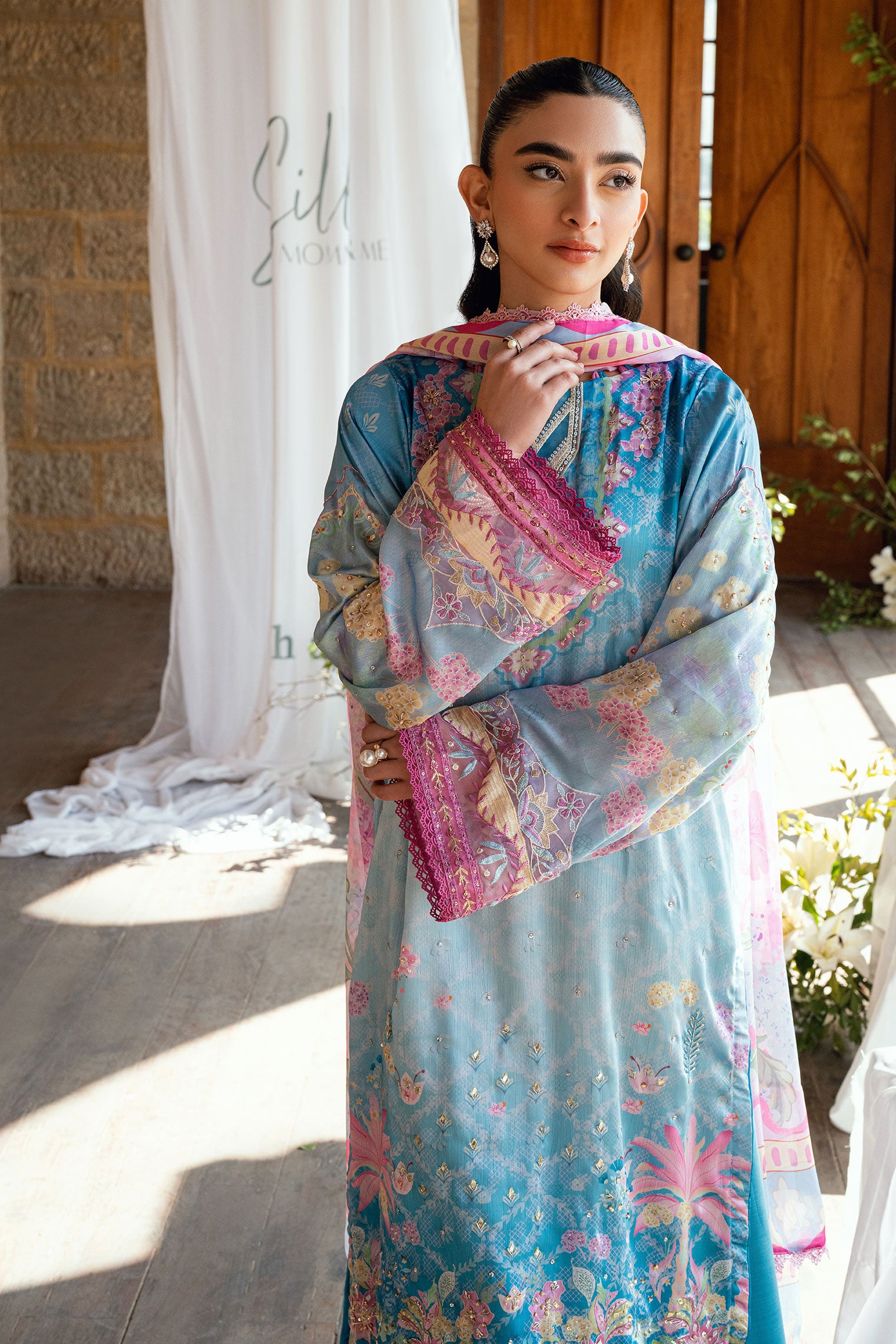 SS26DA-2898 Blue 2-piece satin silk ensemble featuring delicate embroidery over a soft print and flared pants with lace hem.