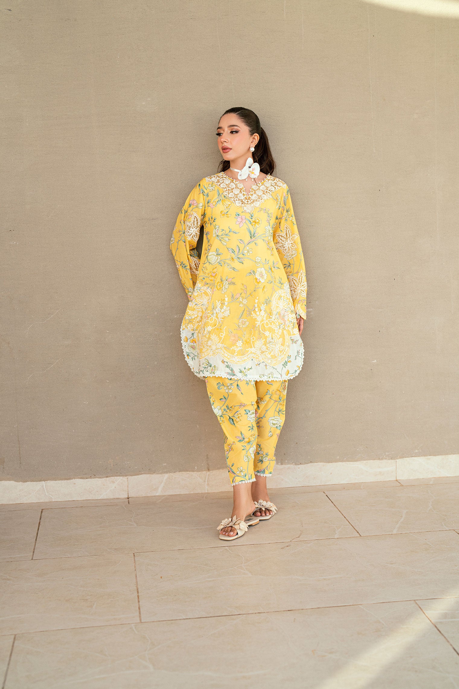 SS25DC-2534 Yellow 2-piece premium lawn ensemble with a printed shirt and delicate embroidery for a festive look.