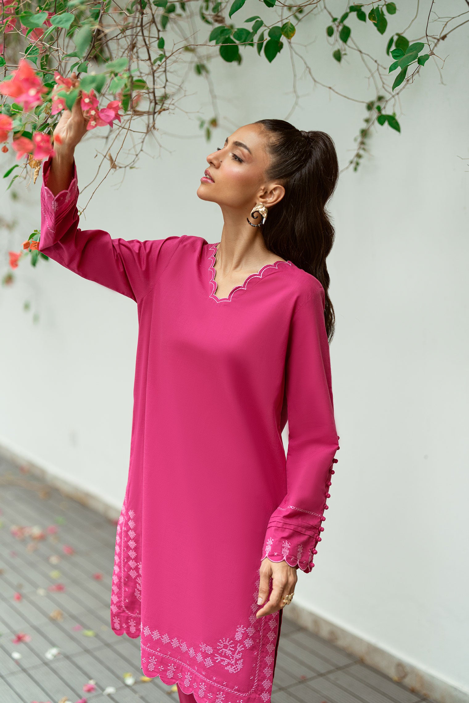 SS25DC-2572 Dark pink 2-piece with a detailed embroidered neckline and sleeves, paired with an embroidered shalwar-style finish.