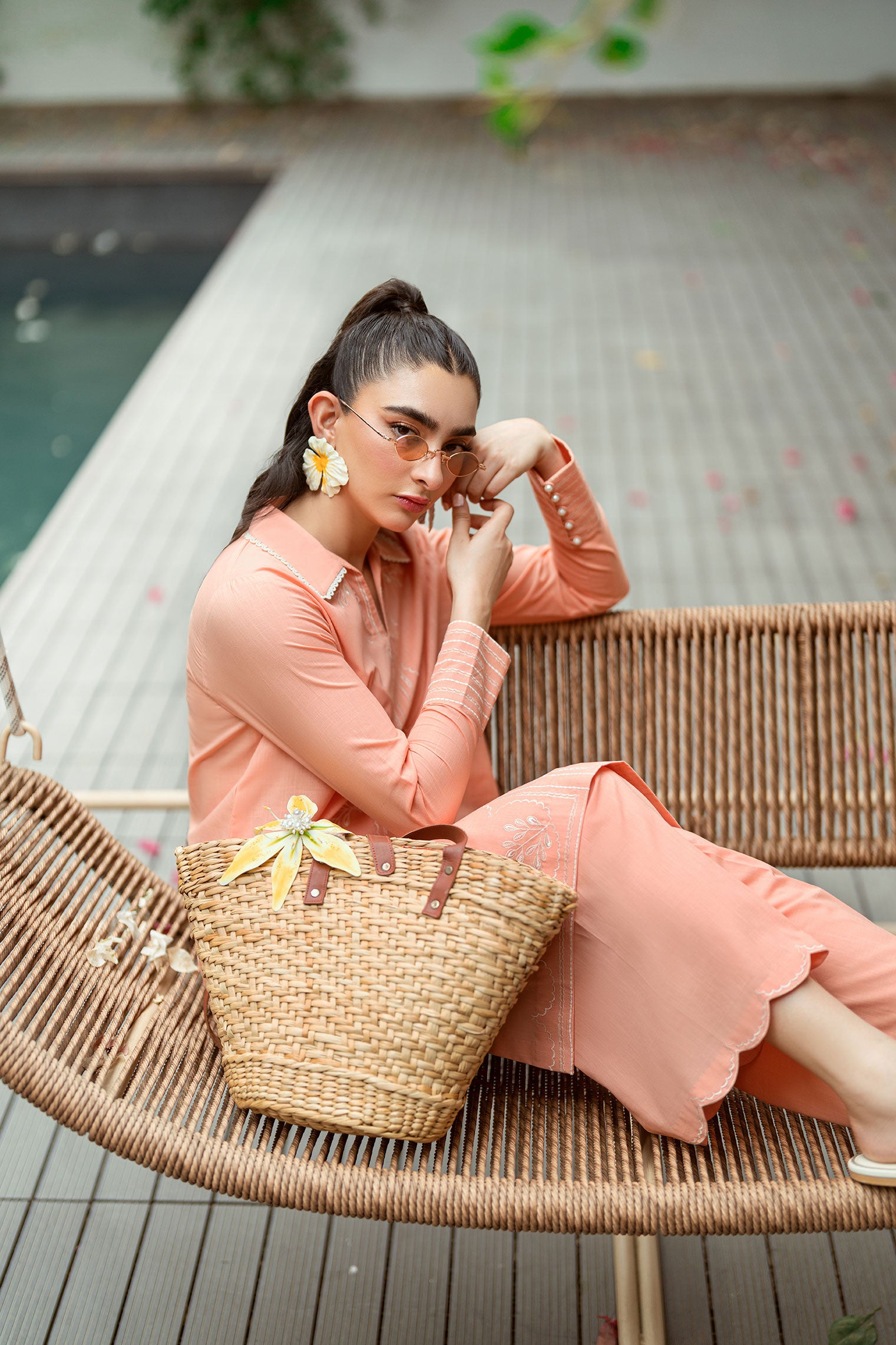 SS25DC-2573 Peach 2-piece ensemble featuring an embroidered kurta with delicate floral threadwork on the neckline and sleeves, paired with solid trousers.