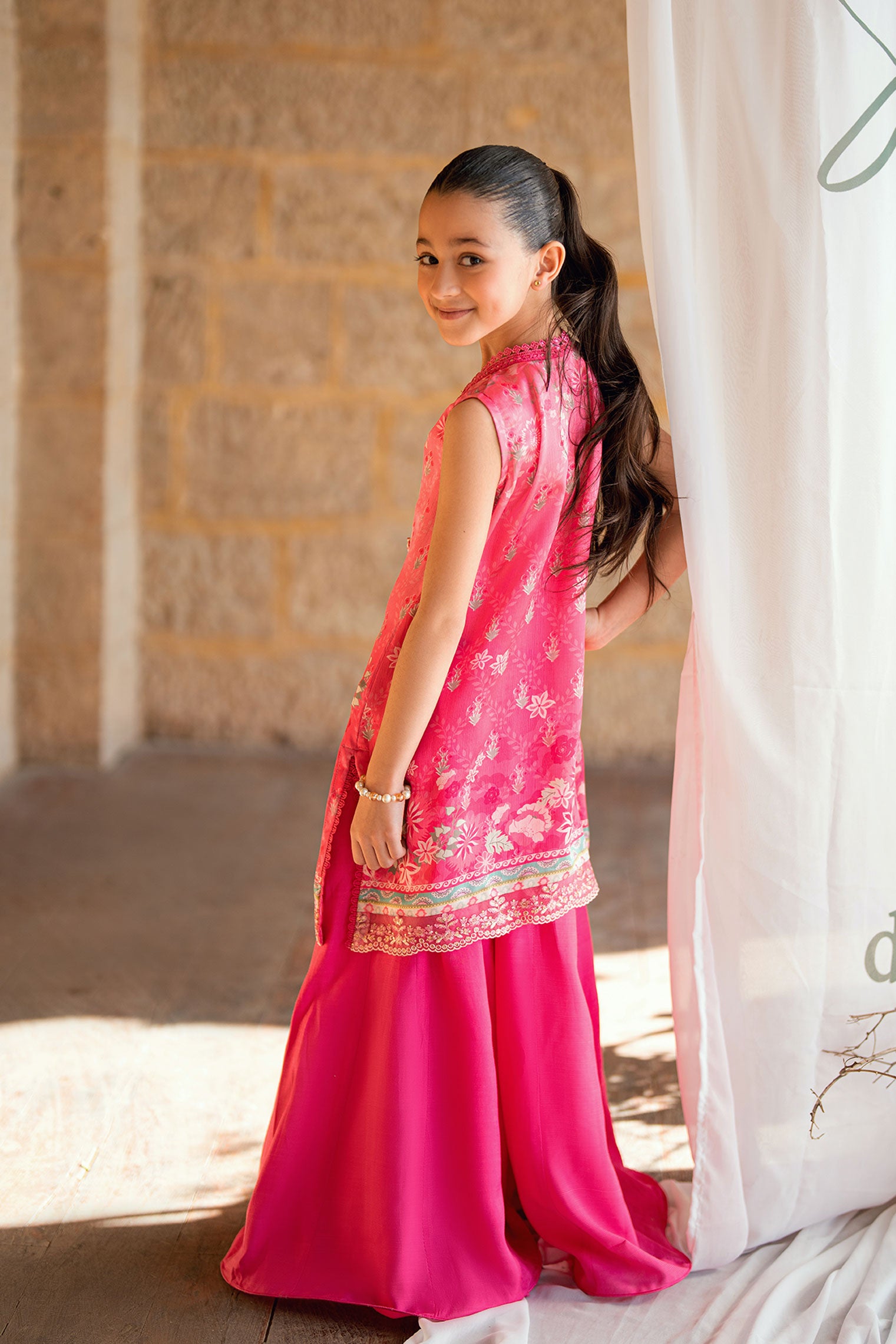 Kids pink 2-piece satin silk outfit with delicate embroidery.