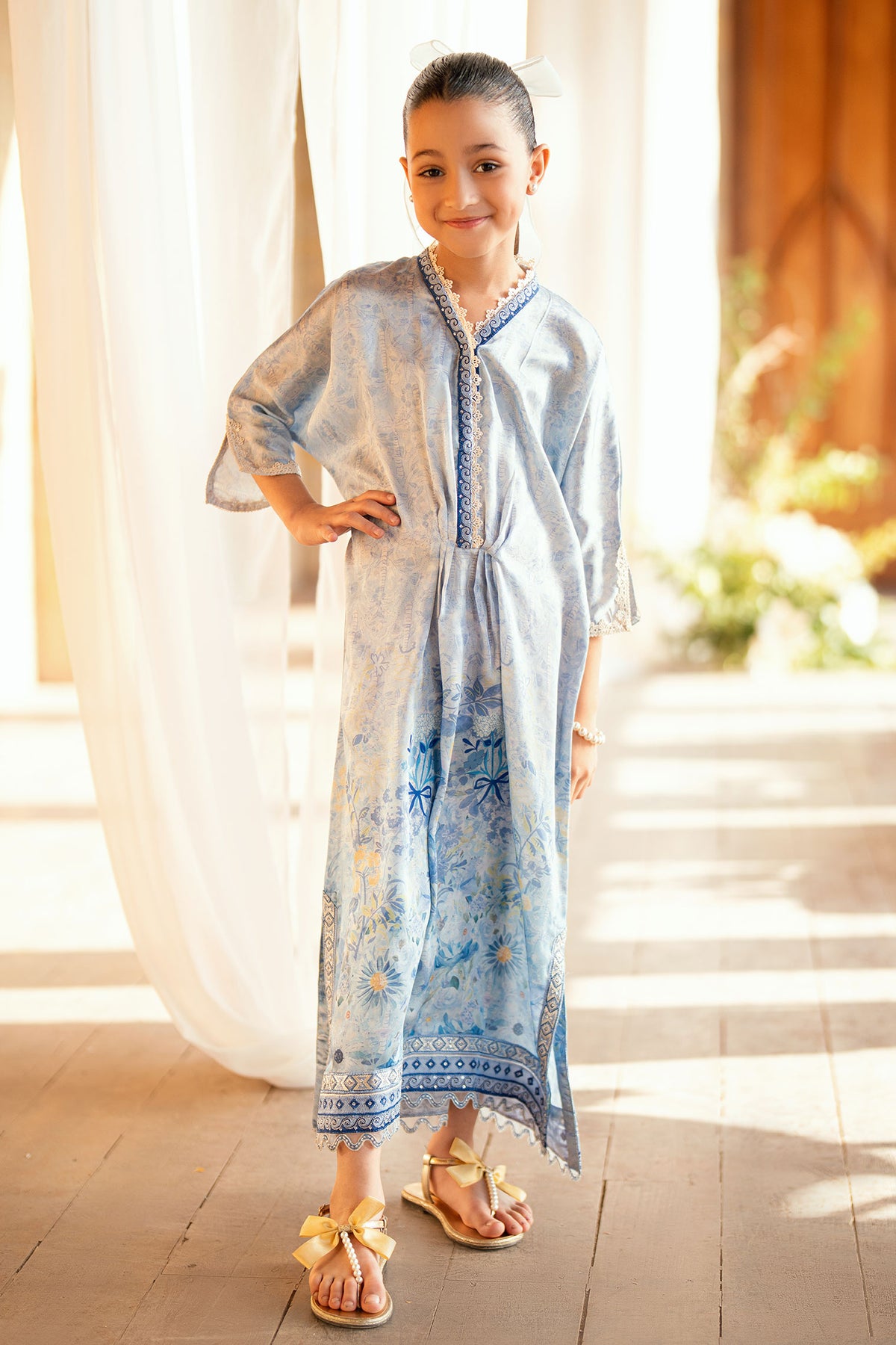 Kids sky blue shamoz silk kaftan with light embellishments.