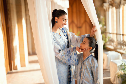 Kids sky blue shamoz silk kaftan with light embellishments.