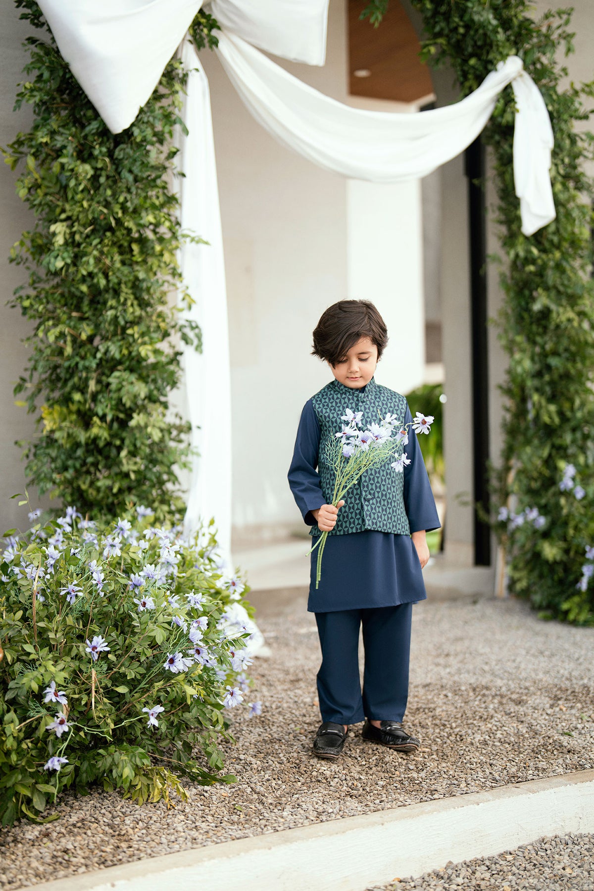 Boys navy blue kurta pajama with detailed waistcoat.