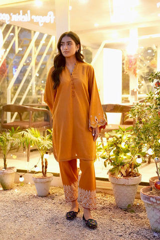 FW25DC-2881 Mustard 2-piece karandi ensemble with white and orange embroidery and scalloped neckline.