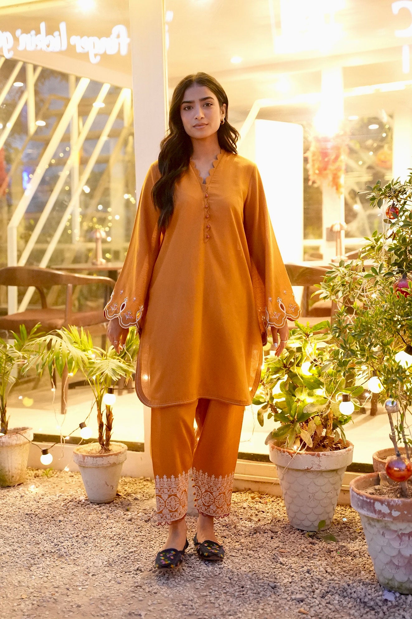FW25DC-2881 Mustard 2-piece karandi ensemble with white and orange embroidery and scalloped neckline.