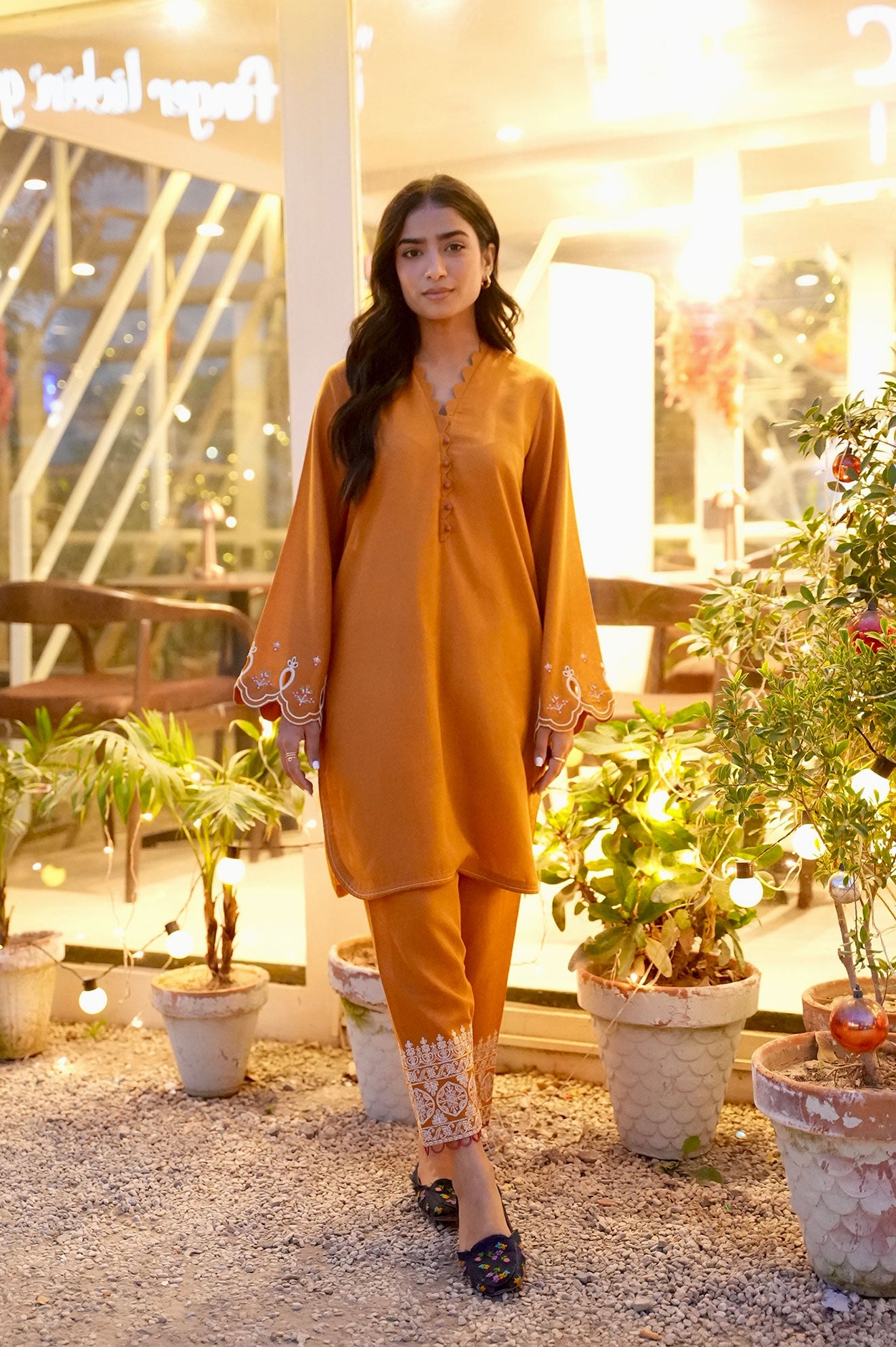 FW25DC-2881 Mustard 2-piece karandi ensemble with white and orange embroidery and scalloped neckline.