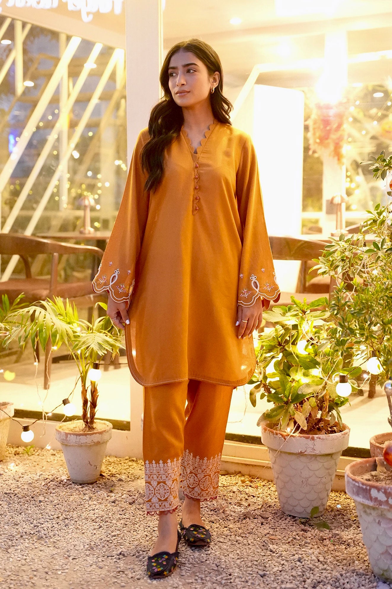 FW25DC-2881 Mustard 2-piece karandi ensemble with white and orange embroidery and scalloped neckline.