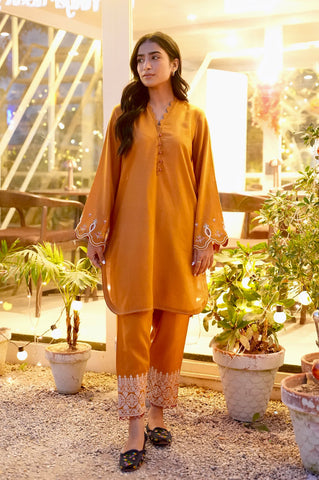 FW25DC-2881 Mustard 2-piece karandi ensemble with white and orange embroidery and scalloped neckline.