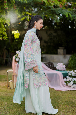 Mint green silk tunic featuring lilac and blush thread embroidery with subtle sequin accents.