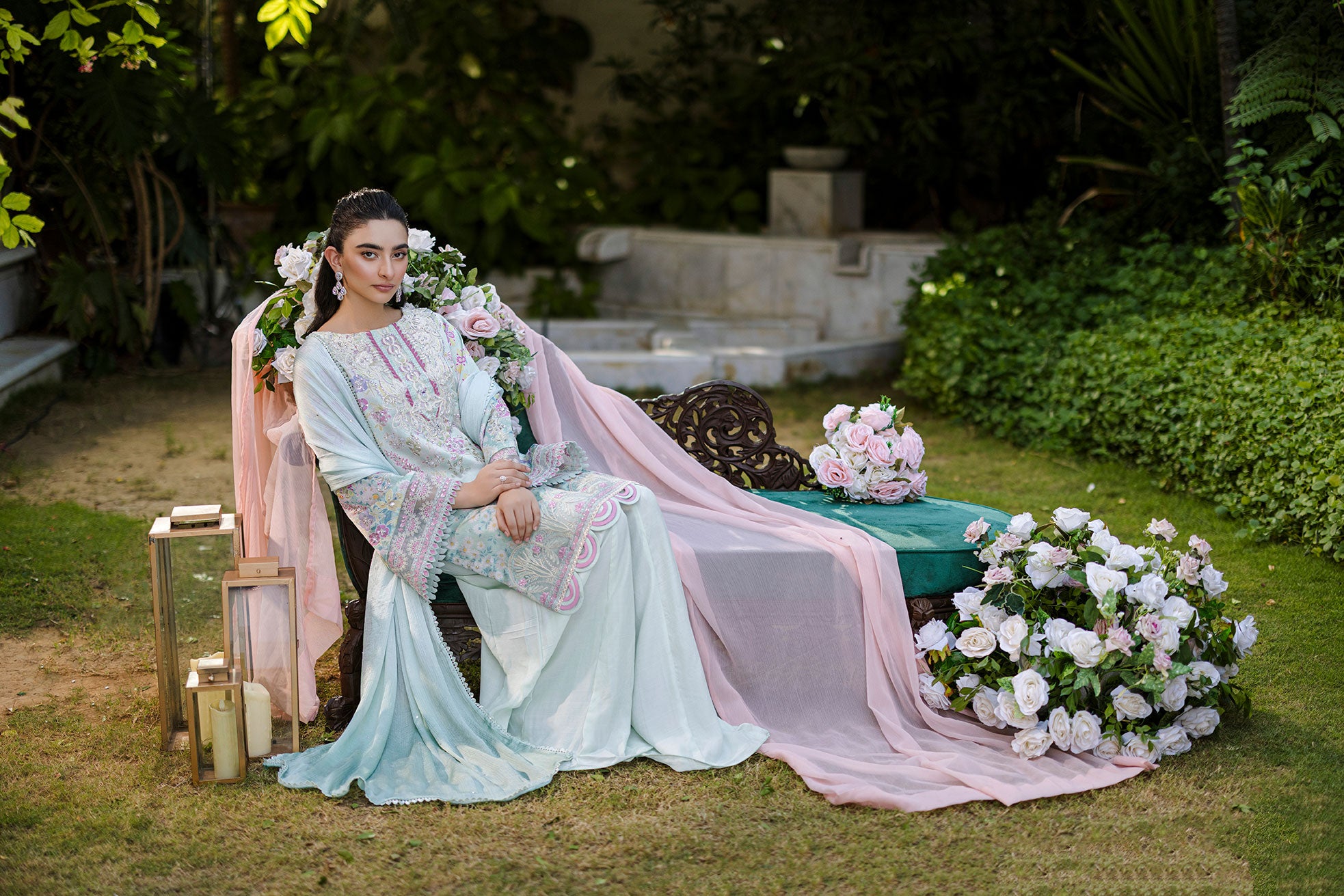 Mint green silk tunic featuring lilac and blush thread embroidery with subtle sequin accents.