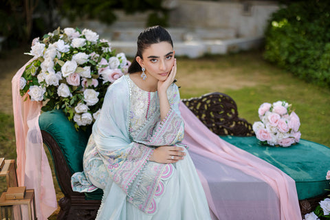 Mint green silk tunic featuring lilac and blush thread embroidery with subtle sequin accents.