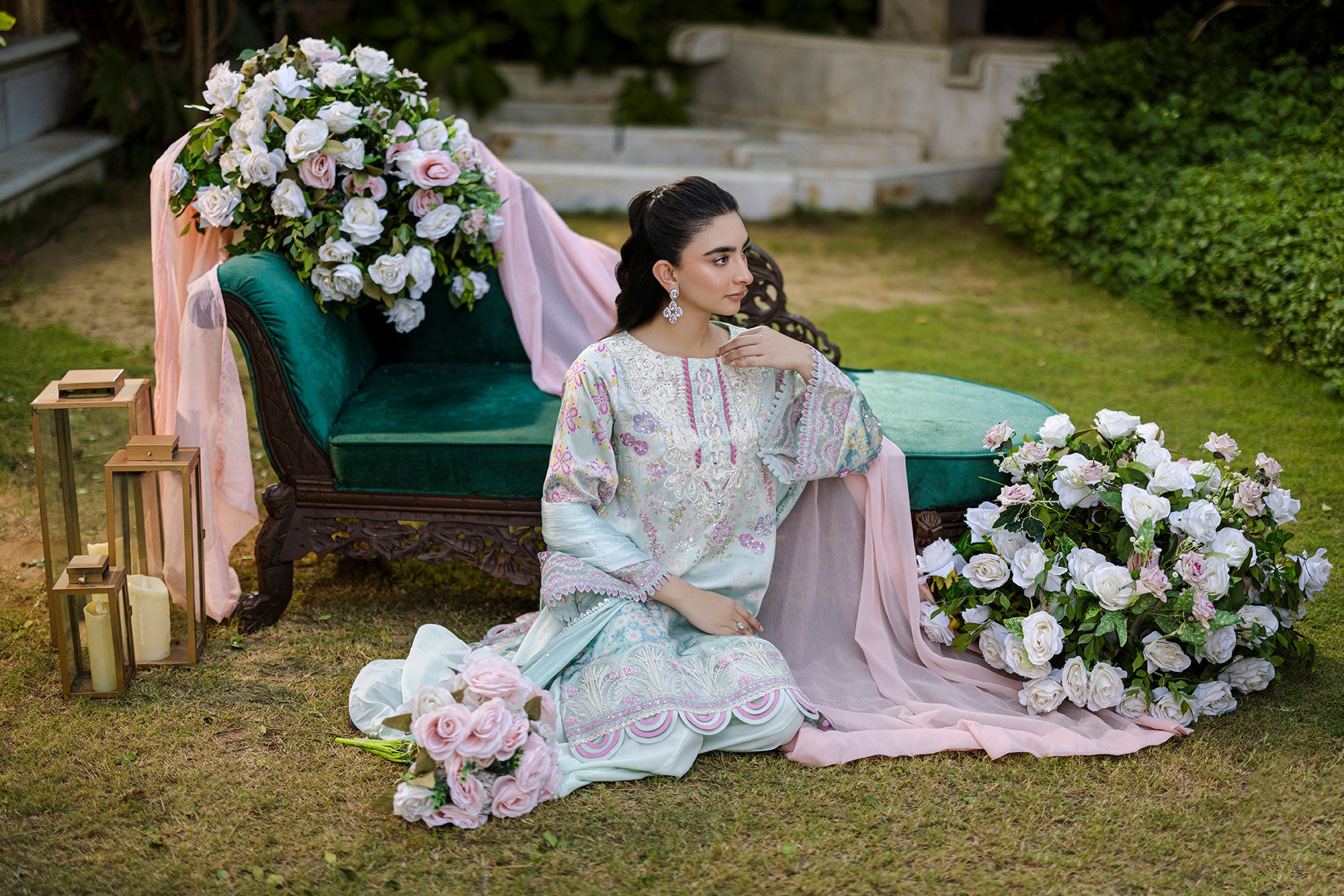Mint green silk tunic featuring lilac and blush thread embroidery with subtle sequin accents.