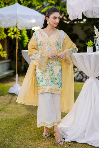 Soft yellow silk ensemble featuring floral and paisley motifs in blue, green, and peach tones.