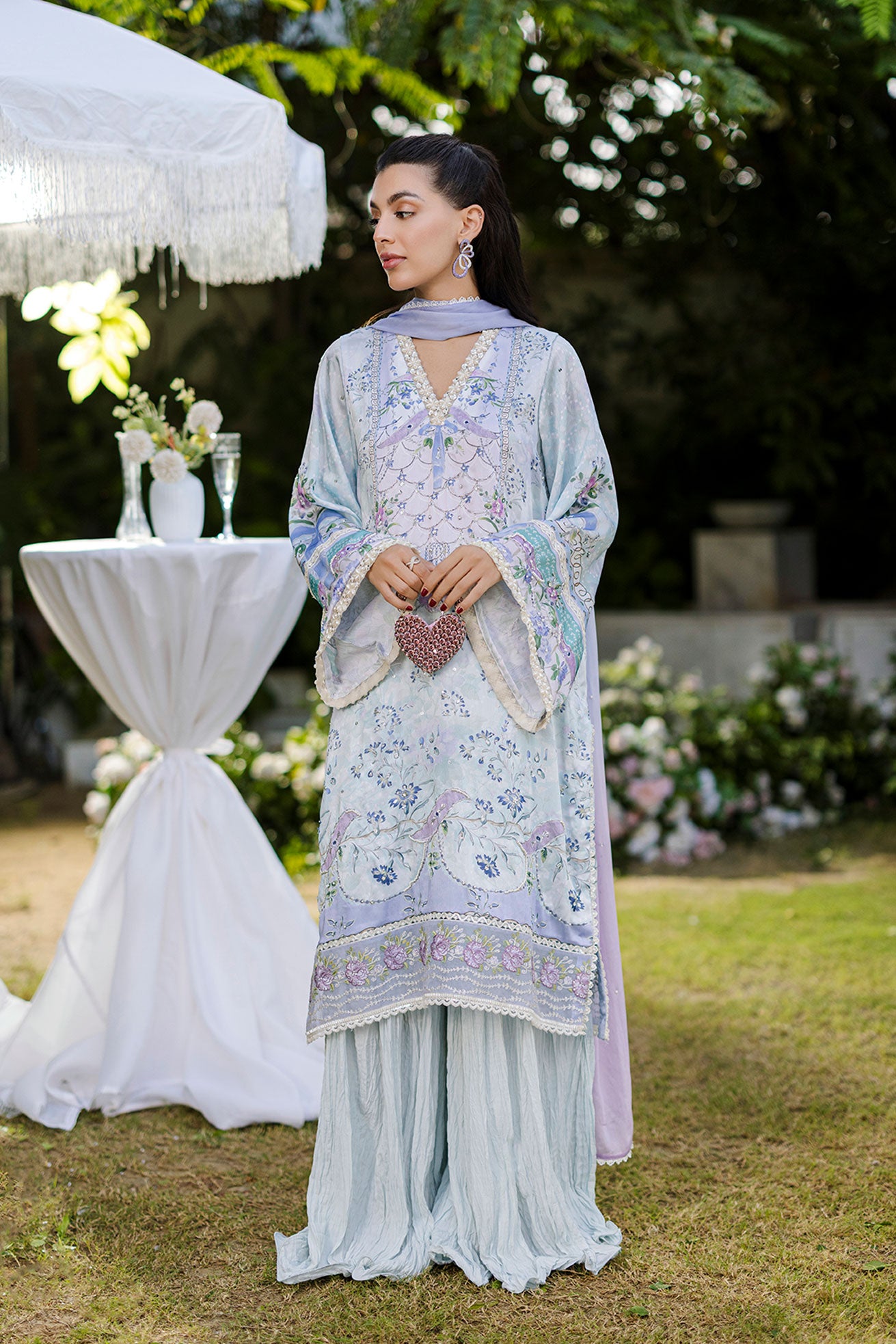 Sky blue 2-piece silk suit with sophisticated hand detailing.