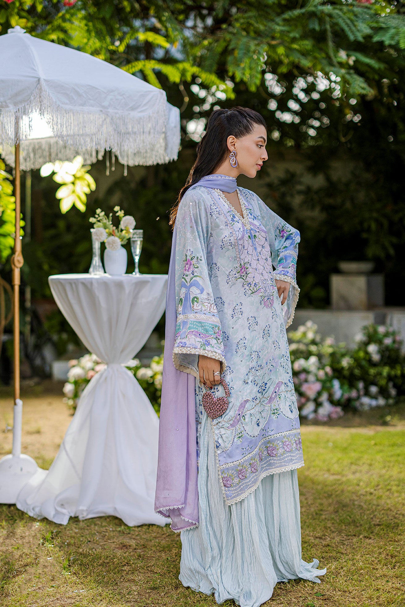 Sky blue 2-piece silk suit with sophisticated hand detailing.