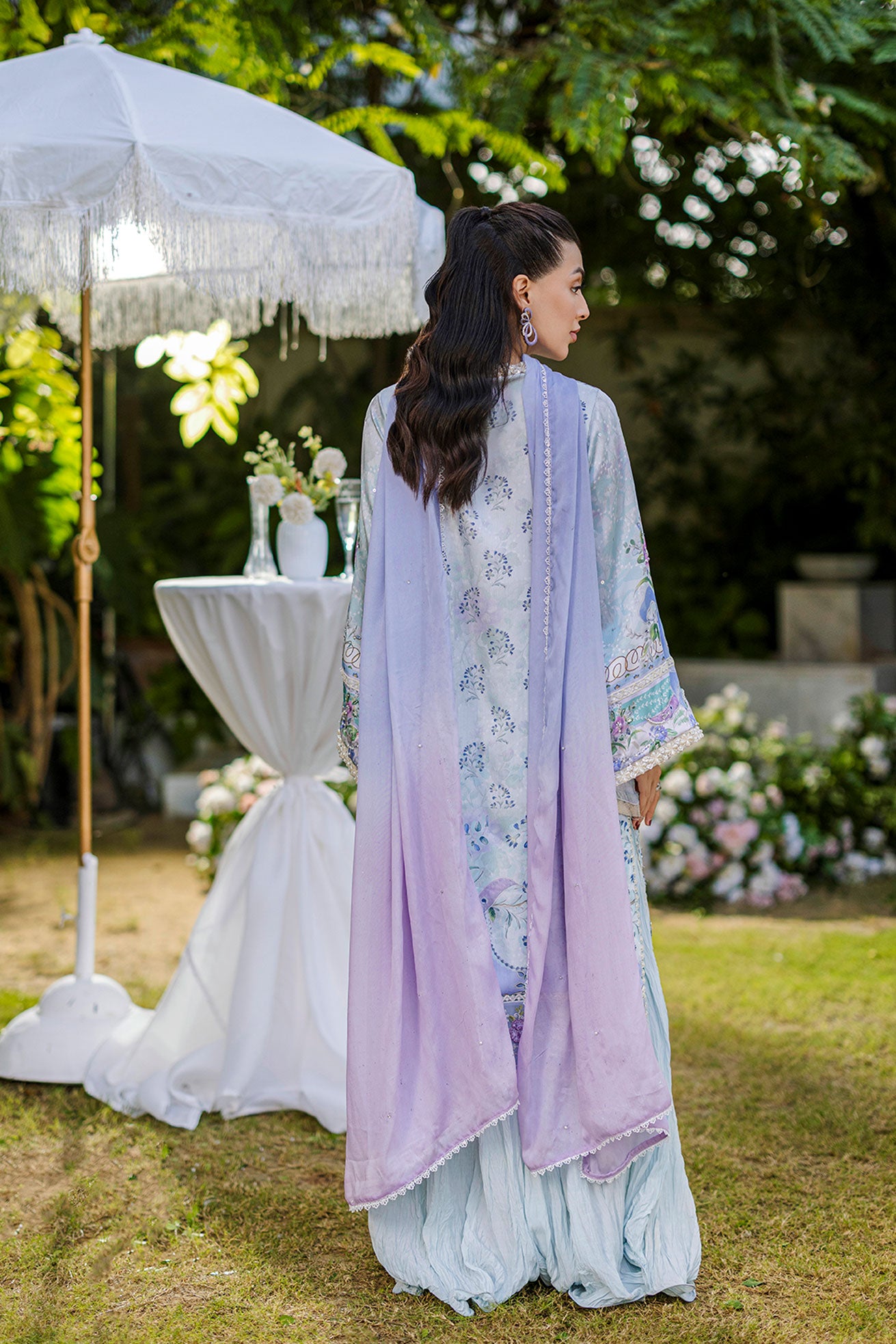 Sky blue 2-piece silk suit with sophisticated hand detailing.